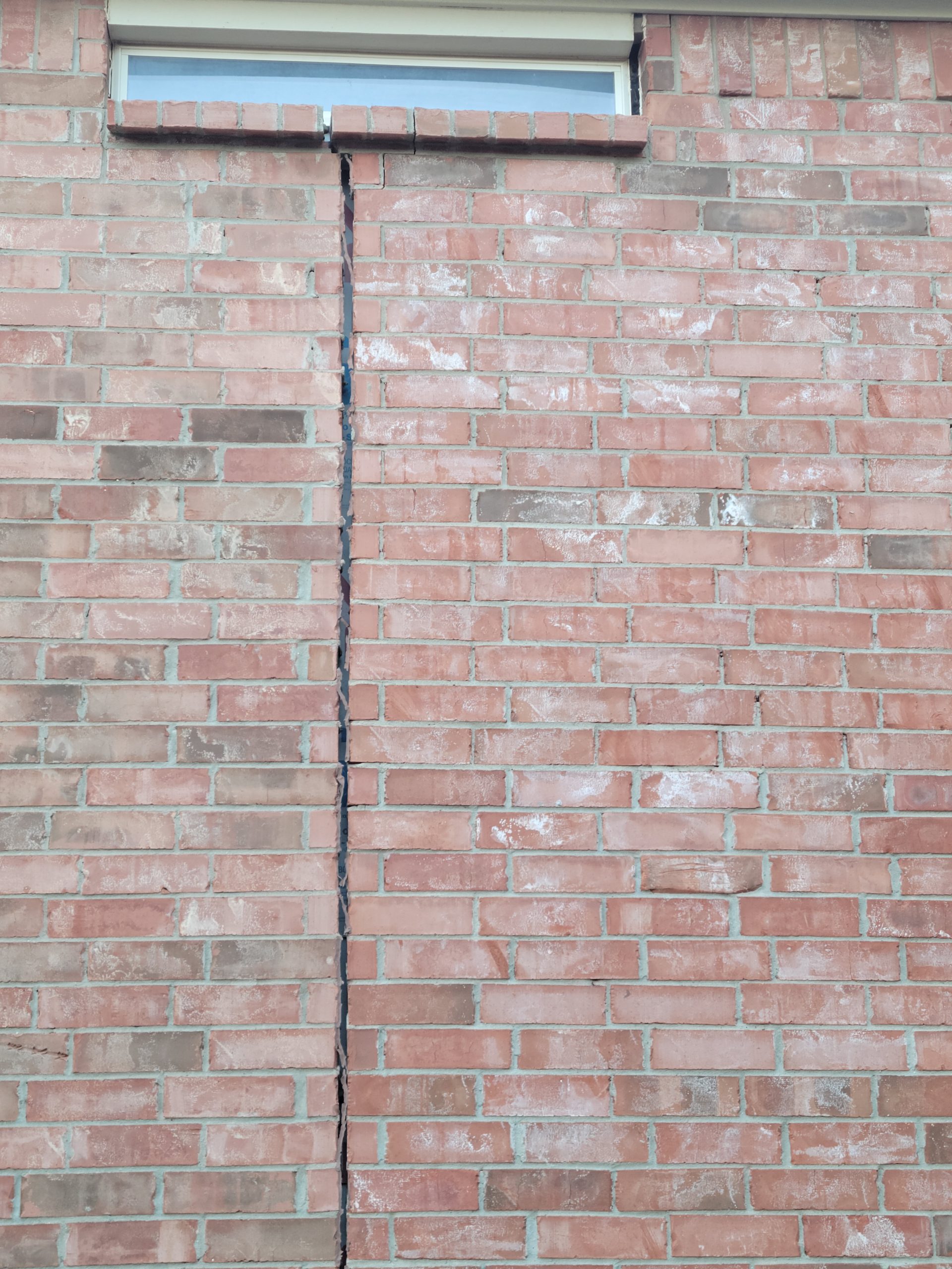 red brick wall crack